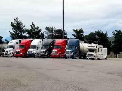 trucking-truck-stop-parking-patriotic-red-white-2023-11-27-05-28-02-utc-1
